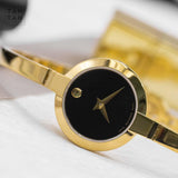 Movado Bela Black Dial Gold Steel Strap Watch For Women - 0606999 Authentic Buy Shop Now